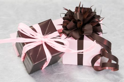 gift pink and brown box with ribbons and bow