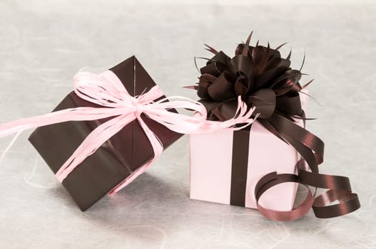 gift pink and brown box with ribbons and bow