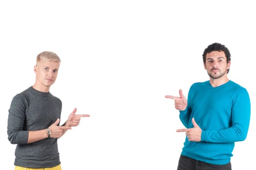 Two handsome guys showing somewhere with fingers, isolated on white