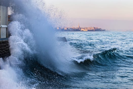 A wave breaks in Rochebonne, Saint-Malo, France in February 2019