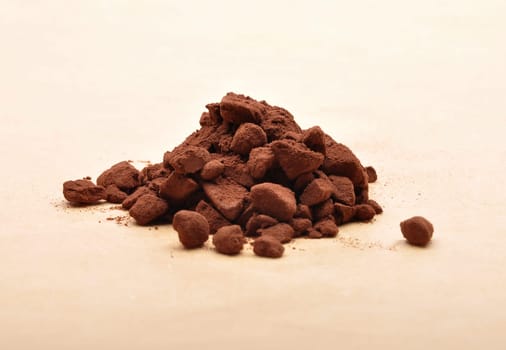Cacao powder on brown background