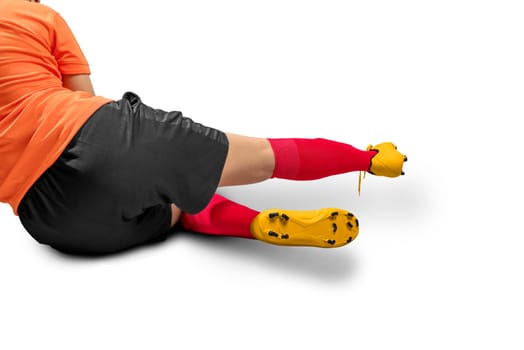 Football player woman in orange jersey in action posing isolated over white background