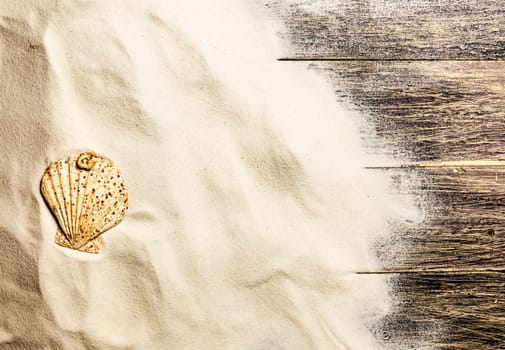 Top view of shells on the sand with wooden floor background