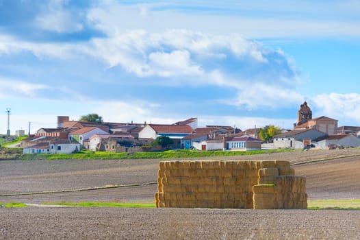 Landscape with village and stack of hay. Spain