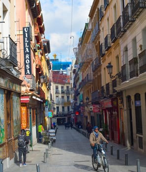 MADRID, SPAIN - NOVEMBER 07, 2016: People at an Old Town street in Madrid. Madrid is the capital of Spain.