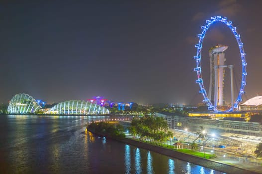 SINGAPORE - FEBRUARY 16, 2017: Gardens by the Bay , Marina Bay Sands Resort , Singapore Ferris Wheel at night. Singapore