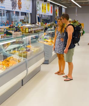 PORTO, PORTUGAL - SEPTEMBER 11, 2018: Consumers at vegetable market in Porto, Portugal. Porto famous tourist destination in Portugal