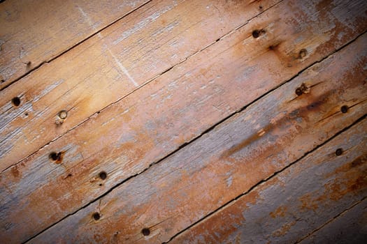 Rustic brown wood planks background with vignetting effect