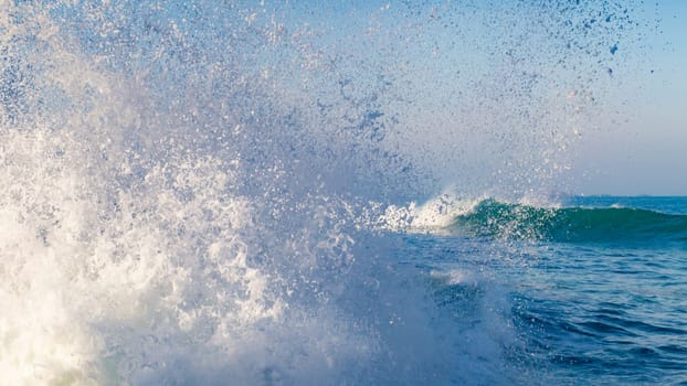 splashing wave near the coast in Brittany, France