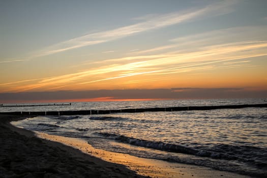 Breakwater built of wooden logs by the Baltic Sea.