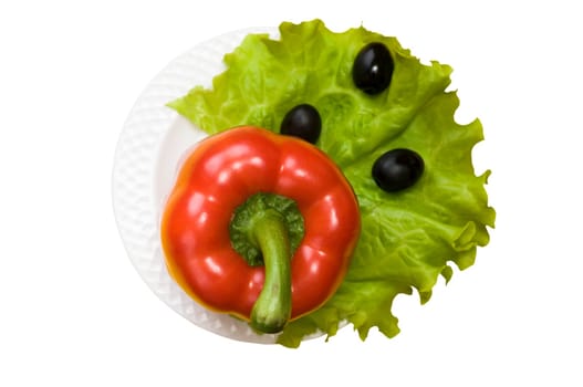 Bell pepper, olives, salad lettuce on white plate isolated on white background