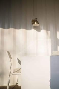 White table and chair in cargo container living room, stock photo