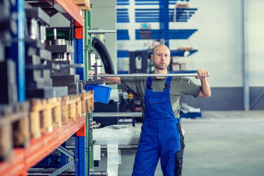 one worker in factory in stockroom