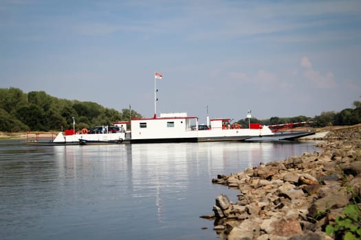 ferry crosses the Elbe with cars