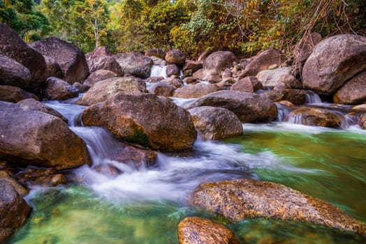 River stone and waterfall, View water river tree, Stone river in multi color tree leaf in forest