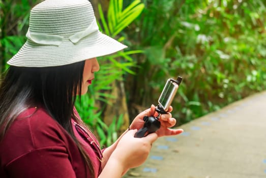 Social network and photography concept, Women with smart phone mobile on blurred background