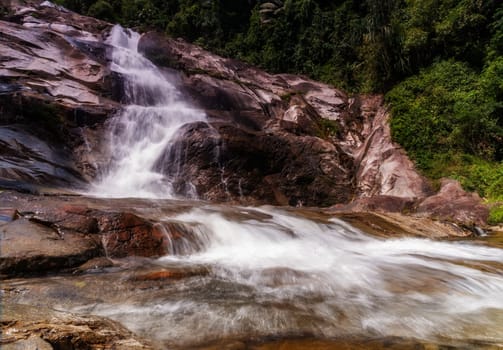 Water fall with sunlight and beautiful view nature dark filter style