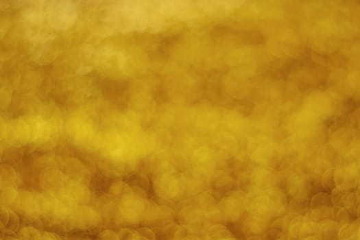 Glitter light abstract gold bokeh christmas night blurred background
