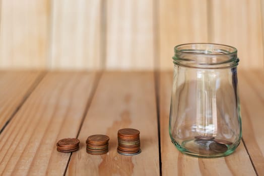 Save money and account banking for finance business concept, Coin money in bottle on business office table, Savings for retirement and investing concept