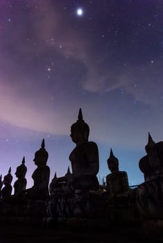 Milky way galaxy with buddha stature landscape nature dark filter style, Nakhon Si Thammarat province, Thailand