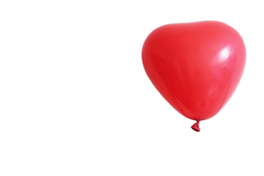 Red heart balloon isolated on white background.