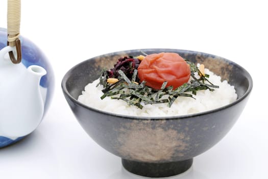 Japanese food, Rice chazuke or ochazuke with umeboshi and shiso, on white background