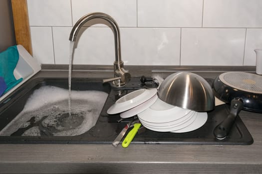 Wash and dry kitchen utensils on the sink by hand