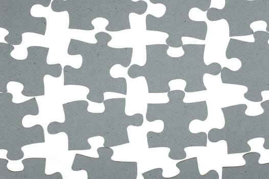 A close up shot of jigsaw pieces