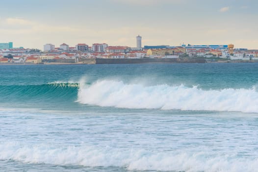 Skyline of Peniche - coastal town in Portugal. Atlantic ocean in the foreground