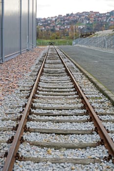 Rail Road Tracks Next to Warehouse Building