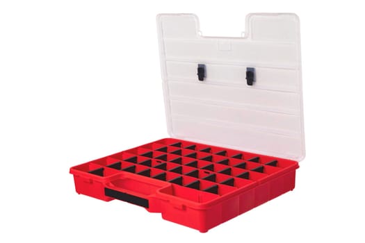 Equipment of craftsman. A empty open professional red plastic storage box for screws, bolts, dowels and some other components isolated on a white background. Handyman accessories.