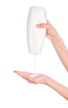 White bottle of shower gel lotion cream in hands pattern on a white background isolation