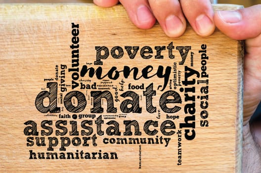 Donate word cloud collage with human hand