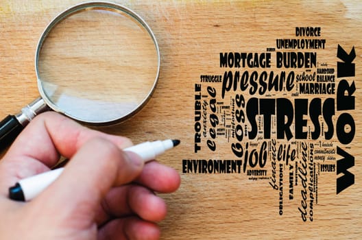 Stress word cloud design over wooden background and human hand