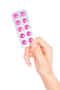 Woman hand holding pills tablet. Female hand holding prescription pill over white background.