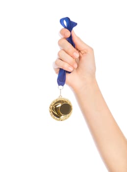 Girl hand raised holding gold medal against white background award and victory concept