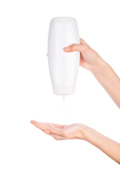 White bottle of shower gel lotion cream in hands pattern on a white background isolation