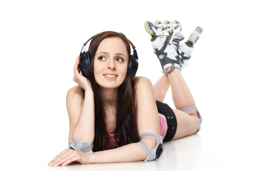 The beautiful young woman in rollerskates on a white background.