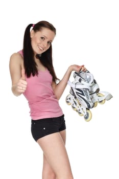 Young sporty woman with rollerskates on a white background.