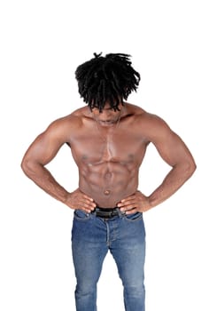 A handsome African man standing from the front, looking down with.his fuzzy hair and shirtless, isolated for white background.
