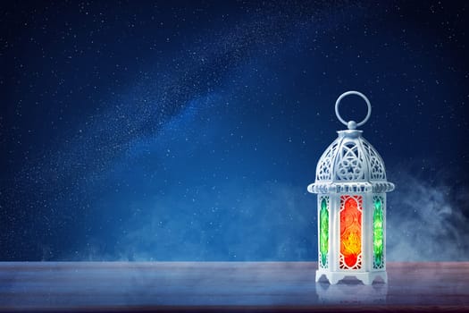 Arabic lamp with beautiful light on wooden table at outdoor with night scene background