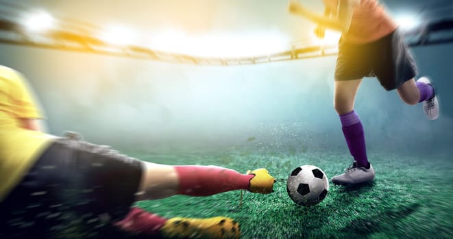 Football player woman in yellow jersey sliding tackle the ball from his opponent on football field at stadium