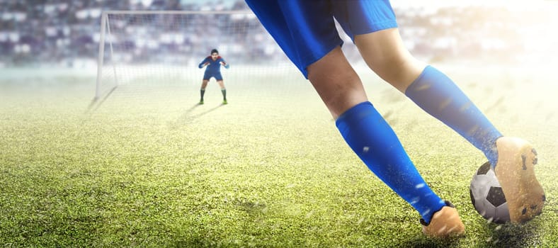 Football player man kicking the ball in the penalty box on football field at stadium