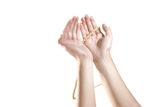 Muslim hands praying with prayer beads isolated over white background