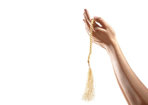 Muslim hands praying with prayer beads isolated over white background.