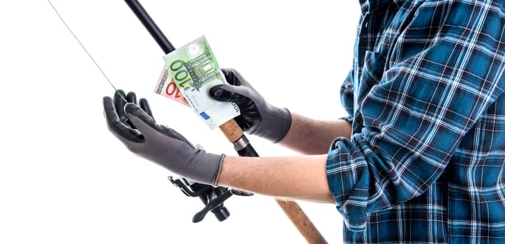 man with fishing rod and money in blue plaid shirt in front of white background