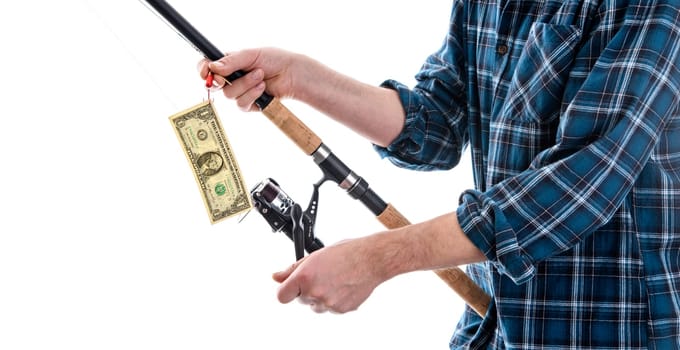 man with fishing rod and money in blue plaid shirt in front of white background