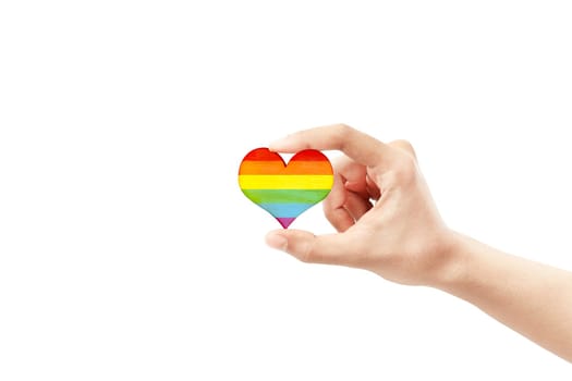 Human hands showing heart with rainbow flag as a symbol of LGBT isolated over white background