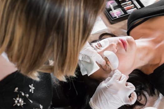 Cosmetic procedure of dyeing and lamination of eyelashes. Extension, perm, lamination of eyelashes. Eyelash care.