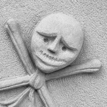 Stone sculpture of the skull with crossbones
